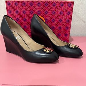 Tory Burch Black Leather Wedges with Gold Logo.
